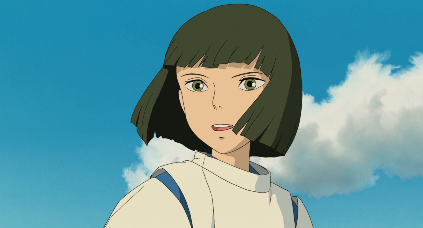 Haku's joyful face before a blue sky