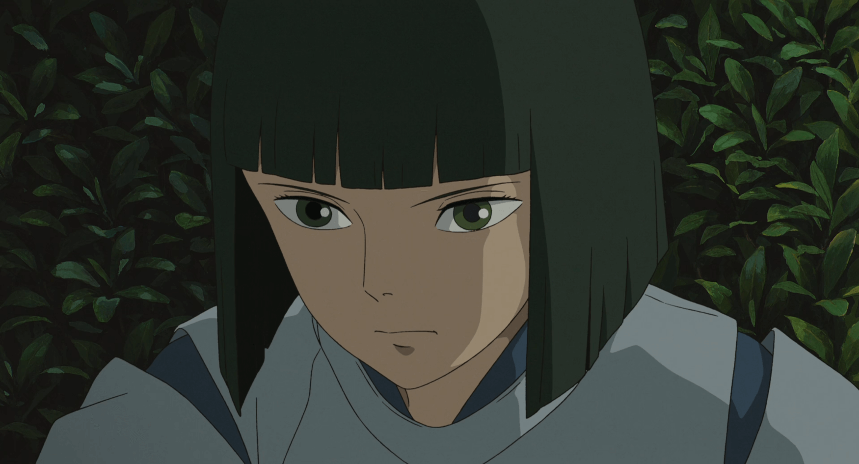 close-up of Haku's face in the garden