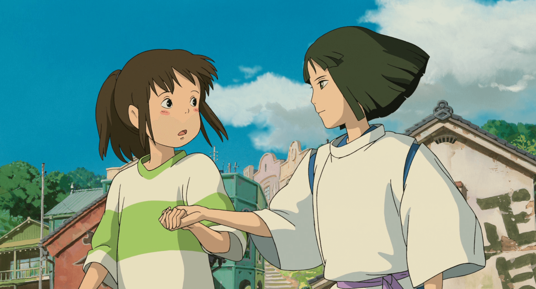 Haku points Chihiro's hand towards the path out of the spirit world