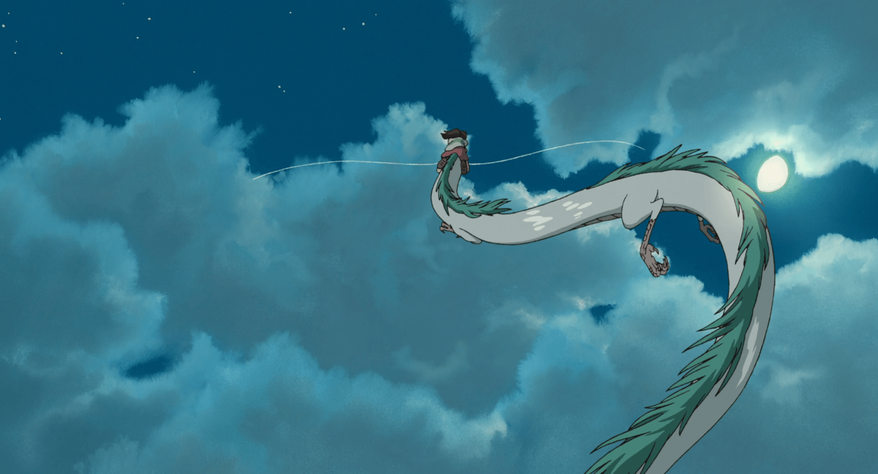 Dragon Haku carries Chihiro into the azure sky