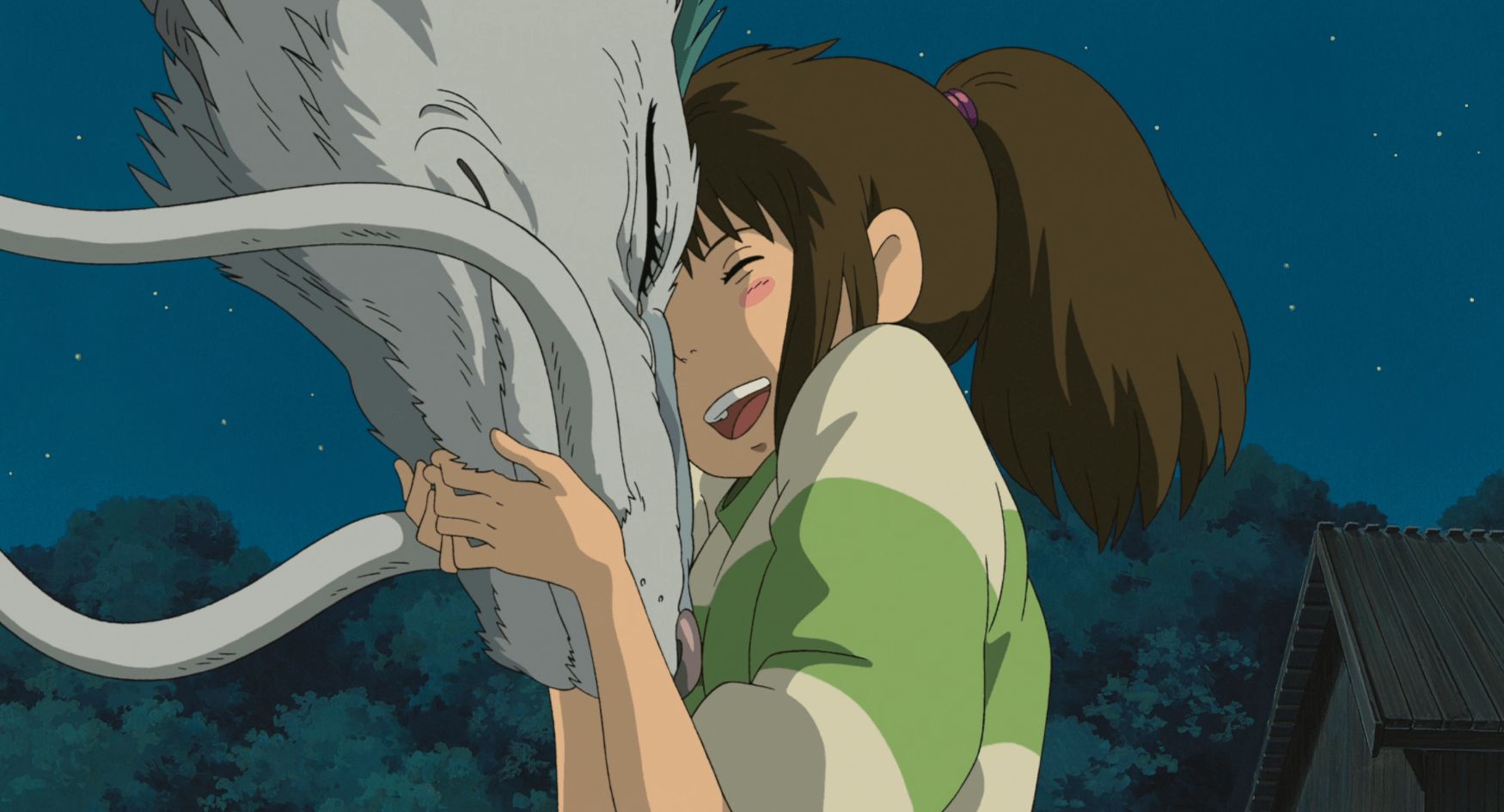 Chihiro hugs Dragon Haku near Zeniba's cottage