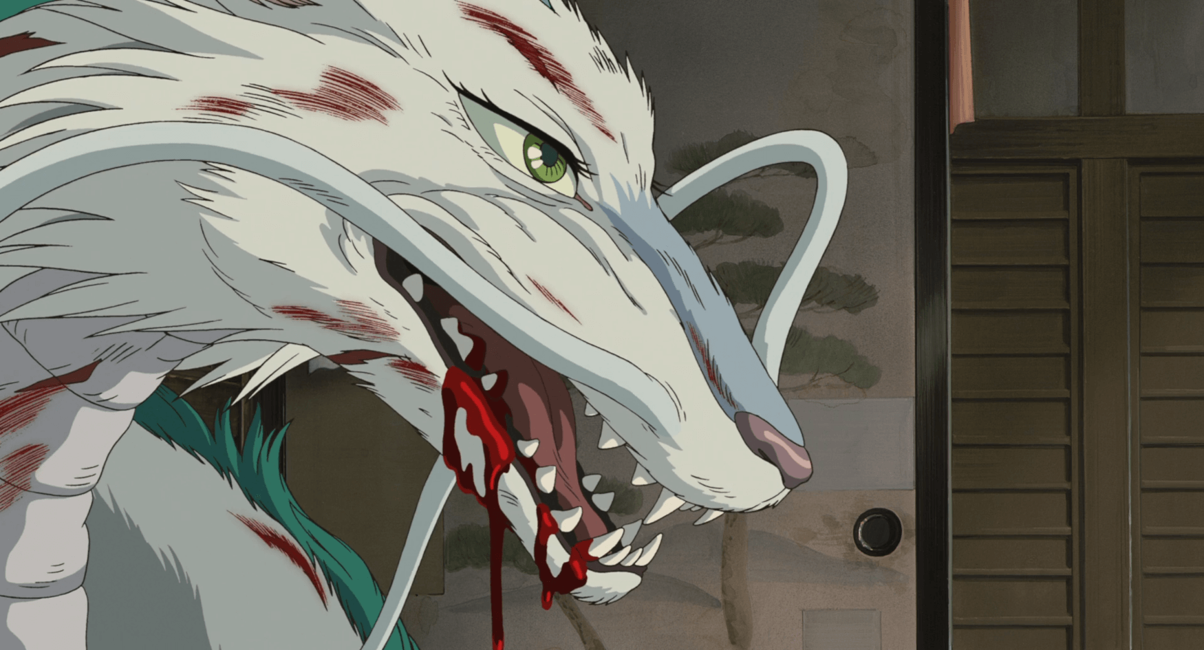 Dragon Haku growls as blood seeps from his mouth